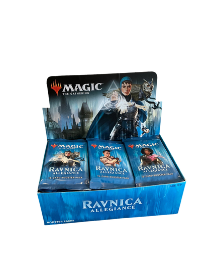 An open booster box of Magic the Gathering Ravnica™ Allegiance showing off a full set of booster packs with different pack art.