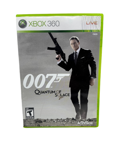 Xbox 360 game case for '007 Quantum of Solace' with a man holding a gun on the cover.