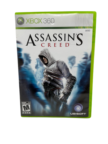 Assassin's Creed game case for Xbox 360 with character in hooded outfit on white background