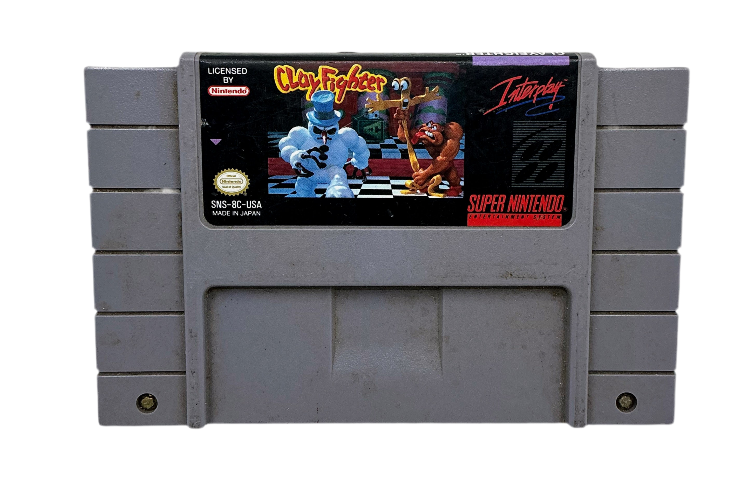 An old video game cartridge for the Super Nintendo game Clay Fighter out of box and on a white background.