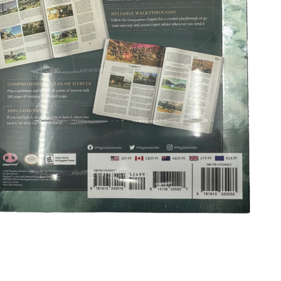 Close-up shot of the back cover of The Legend of Zelda companion book for Tears of the Kingdom. Features price tag information.